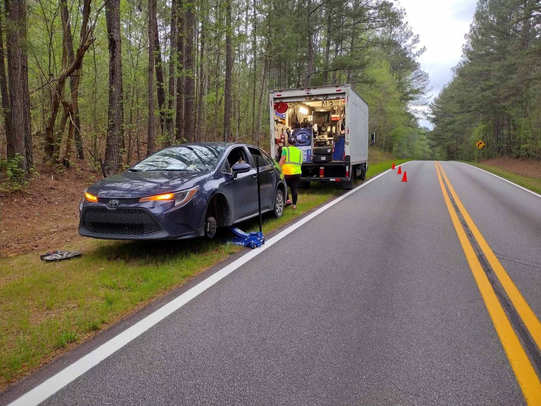 Roadside flat-tire change on a car